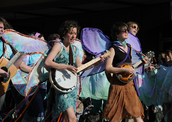 Procession of the Species parade Olympia butterfly banjo and mandolin players