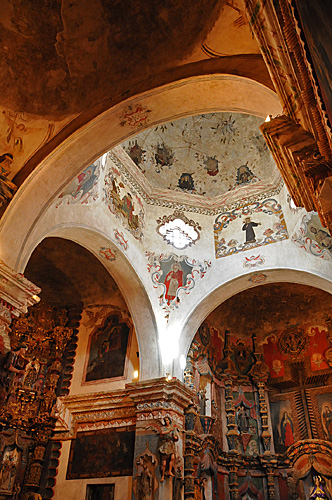 Mission San Xavier del Bac interior figures arches ceiling and ornamentation in Tucson Arizona