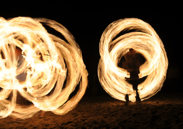 Golden Gardens fire spinner dancer performers at Bonfire and Christmas Tree Immolation party